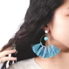 round tassel earrings, large round design, cool turquoise color, handmade fashion accessory, captivating