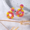 circle of life clay earrings, each color segment is pieced together with shimmering metallic edges, meaningful gift for friends