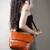 coffee brown leather crossbody bag, crafted from premium full grain leather, large bag design, delicate style