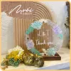 two flowers, round dried flower frame, conveying messages of love, decorative accessories, handcrafted product, meaningful gift