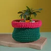 green with orange and deep pink border crochet cotton basket, impressive color scheme, intricate crochet technique, home decoration