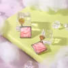 square clay earrings, accentuating facial features, harmonious color combination, impressive square earring shape