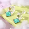 square clay earrings, accentuating facial features, harmonious color combination, impressive square earring shape