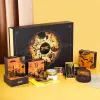 “Brown Moonlight” gift box with 4 chocolate mooncakes, assorted chocolates, nuts & cutlery set – premium Mid-Autumn corporate gift.