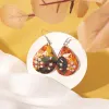 medium water drop earrings with lacquered pattern, rustic material, unique artistic lacquer patterns, eye-catching, unique earrings