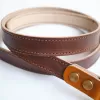 veg-tan leather camera strap, premium leather material, meticulous stitching, minimalist and practical design