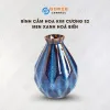 The Ocean Blue Fire-Glazed Diamond Ceramic Vase from Bat Trang Ceramic is an exquisite pottery vase that serves as a stunning stage for floral beauty, making it a perfect home decor piece and an ideal housewarming gifts
