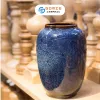 The Ocean Blue Fire-Glazed Ceramic Tube Vase from Bat Trang Ceramics is a minimalistic yet memorable cylinder pottery vase, perfect for home decoration or as a thoughtful housewarming gift.