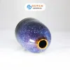 The Ocean Blue Fire-Glazed Ceramic Narrow Mouth Vase, sized 8 x 11cm, adds a distinctive touch to your space as a stunning Bat Trang flower vase, perfect for home decor or as a thoughtful housewarming gift.