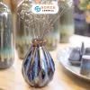 The Ocean Blue Fire-Glazed Diamond Ceramic Vase from Bat Trang Ceramic is an exquisite pottery vase that serves as a stunning stage for floral beauty, making it a perfect home decor piece and an ideal housewarming gifts