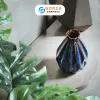 The Ocean Blue Fire-Glazed Diamond Ceramic Vase from Bat Trang Ceramic is an exquisite pottery vase that serves as a stunning stage for floral beauty, making it a perfect home decor piece and an ideal housewarming gifts