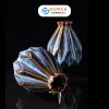 The Ocean Blue Fire-Glazed Diamond Ceramic Vase from Bat Trang Ceramic is an exquisite pottery vase that serves as a stunning stage for floral beauty, making it a perfect home decor piece and an ideal housewarming gifts