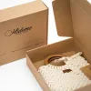 macrame handbag, wooden handle, simple and elegant design, subtle color palette, feminine accent for outfits, suitable for various occasions