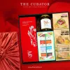 "The Festive Season" Gift Box, features a curated selection of Vietnamese Delicacies, including Phung Thi Apricot Craft Liqueur, Coffee Blossom Honey, and Chocolate and Fruit.