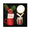 The "Cozy Christmas Eve" Gift Box is a colorful Christmas gift set including a ceramic mug, scented candles, a moon night light, and Christmas-themed socks