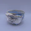 The "Fish-FLick" Ceramic Mug is a handmade abstract ceramic piece that serves as a daily reminder to stay calm, making it a unique addition to your home decor and a perfect unique handmade gift