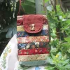 The Magpie Robin Phone Bag, with its vibrant and vintage colors, is a charming handmade patchwork phone pouch, doubling as a mini crossbody bag and making it a perfect vintage handmade accessory and thoughtful gift for her