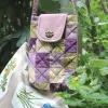 The Magpie Robin Phone Bag, with its vibrant and vintage colors, is a charming handmade patchwork phone pouch, doubling as a mini crossbody bag and making it a perfect vintage handmade accessory and thoughtful gift for her