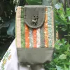 The Magpie Robin Phone Bag, with its vibrant and vintage colors, is a charming handmade patchwork phone pouch, doubling as a mini crossbody bag and making it a perfect vintage handmade accessory and thoughtful gift for herThe Magpie Robin Phone Bag, with its vibrant and vintage colors, is a charming handmade patchwork phone pouch, doubling as a mini crossbody bag and making it a perfect vintage handmade accessory and thoughtful gift for her
