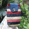 The Magpie Robin Phone Bag, with its vibrant and vintage colors, is a charming handmade patchwork phone pouch, doubling as a mini crossbody bag and making it a perfect vintage handmade accessory and thoughtful gift for her