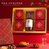 The Deluxe "New Year Blossom" Tet Gift Box with Moc Chau Plum Wine, featuring a premium Tet gift set with wine, nuts, and candies, makes for the perfect Vietnamese gift and a distinguished corporate Tet gift