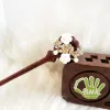The Wreath Wooden Hair Stick captures the beauty of pristine blooms, blending elegance with tradition in a handmade hair stick—a perfect addition to traditional hair accessories and a thoughtful birthday gift for her or a gift for mom