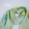 The Yellow & Green Gradient Silk Scarf, crafted from natural silk, showcases a delicate color palette and makes for an authentic Vietnamese souvenir or a thoughtful gift for her