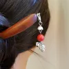 The Pine Cone Dangle Wooden Hair Stick is a handcrafted accessory with intricate details, offering a creative highlight for your hair and making a perfect gift for her