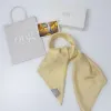 Khăn Lụa Vuông Tơ Vàng - chiếc khăn lụa tơ tằm tự nhiên mềm mại, như mang theo chút nắng nhẹ nhàng, được dệt thủ công tinh xảo làm một phụ kiện sang trọng hay món quà Việt Nam ý nghĩa để làm quà cho nữ
