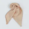 The Ginger Beige Silk Scarf embodies elegance through fluidity, crafted from natural silk using traditional techniques, making it a timeless handmade accessory and a thoughtful Vietnamese gift for her