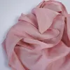 The Rose Pink Silk Scarf embodies dreamy soft beauty, crafted from natural silk as a luxurious Vietnamese souvenir and an impressive gift for her that exudes elegance and timeless charm