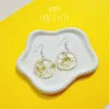 The Resin Flower Earrings are the perfect feminine accessory, handcrafted to shine with purity, making them a unique jewelry piece and an ideal Valentine's Day gift for her or Women's Day gift.
