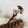 The Wreath Wooden Hair Stick captures the beauty of pristine blooms, blending elegance with tradition in a handmade hair stick—a perfect addition to traditional hair accessories and a thoughtful birthday gift for her or a gift for mom