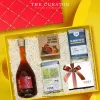 The "Reunion" Gift Box celebrates identity through flavors with apricot liquor, tea, coffee, and confectionery, elegantly curated into a luxurious gift