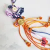 The Lilac "Cat Tuong" Knot Hanging Decoration is a beautifully crafted Vietnamese gift, blending tradition and elegance to send hopes for good fortune; as a Feng Shui-inspired decorative accessory, it makes a unique and meaningful gift for her