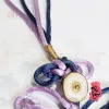 The Lilac "Cat Tuong" Knot Hanging Decoration is a beautifully crafted Vietnamese gift, blending tradition and elegance to send hopes for good fortune; as a Feng Shui-inspired decorative accessory, it makes a unique and meaningful gift for her