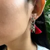 Elevate her style with Silk Tassel Earrings, a mesmerizing fusion of Eastern beauty and artisanal charm - these handmade accessories, adorned with delicate charms, make for a unique jewelry piece and a perfect birthday or special occasion gift for her.