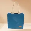The Textile Shopping Bag (26 x 32cm) in Elegant Blue is a stylish and practical fabric gift bag, perfect as an office lunch bag or textile fabric working bag, crafted from high-quality material - a refined handmade gift for any occasion.