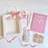 The "Flower Candle" Gift Set is a charming blind bag gift box with scented wax, a notebook, and a ballpoint pen, making it an adorable Women's Day gift for your girlfriend or any cute gift to cherish special moments