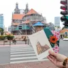 The Notre Dame Cathedral Postcard from the I Love Saigon Collection beautifully captures the city's landmarks in a handmade, layered paper design, making it a unique souvenir complete with an elegant envelope