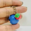 Melt with the cuteness of the Handmade Clay Strawberry-Hat Whale Keychain - an adorable handmade accessory that doubles as a unique bag charm and a thoughtful gift for her!