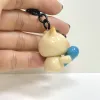 The Handmade Clay Cat Hugging Fish Keychain boasts a charming look that everyone adores, making it a lovely accessory - a handcrafted bag charm and clay keychain that's the perfect cute gift for her