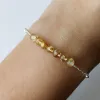 The Silver & Golden Rutilated Quartz Bracelet is a handmade silver treasure that beautifully embodies femininity, offering an elegant jewelry piece that makes a unique souvenir or a perfect gift for her.