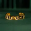 The "Cat & Box" Metal Cuff Bracelet With Hand-Painted Leather is a handmade fashion accessory that beautifully highlights individuality, making it a perfect birthday gift for her.