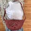 Dark pink half-moon crossbody bag from old jeans amplifying personal style, featuring premium upcycled jeans bag design as a creative birthday gift for sustainable fashion