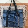 Patchwork flap tote bag from old jeans creates impressive shapes in any space while embodying sustainable fashion principles in a unique accessory that makes for a thoughtful handmade gift