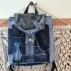 Diagonal pattern mini backpack repurposed from old jeans features bold linear elements, combining denim style with durable fabric construction as sustainable fashion accessory and uniquely creative handcrafted birthday gift