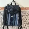 Layered mini backpack crafted from old jeans ignites your personal style through upcycled fabric design, combining rugged fashion aesthetic with environmental consciousness as unique recycled accessory and creative birthday gift