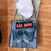 Túi tote Saigonese từ jeans tái chế – túi tote cỡ lớn mang dấu ấn thời gian sinh động, phụ kiện thời trang bền vững, quà sinh nhật sáng tạo, quà lưu niệm Sài Gòn độc đáo.
