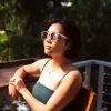 Brown frame sunglasses made from recycled plastic featuring an impressive elegant design, providing effective UV protection with premium quality, serving as both an eco-friendly recycled accessory and unique thoughtful birthday gift.